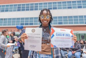 An RP Scholar poses with certificates from Richmond Promise and Congressman John Garamendi.