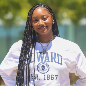 Kynnedy Cannon head shot wearing white Howard University long sleeve shirt with blue lettering
