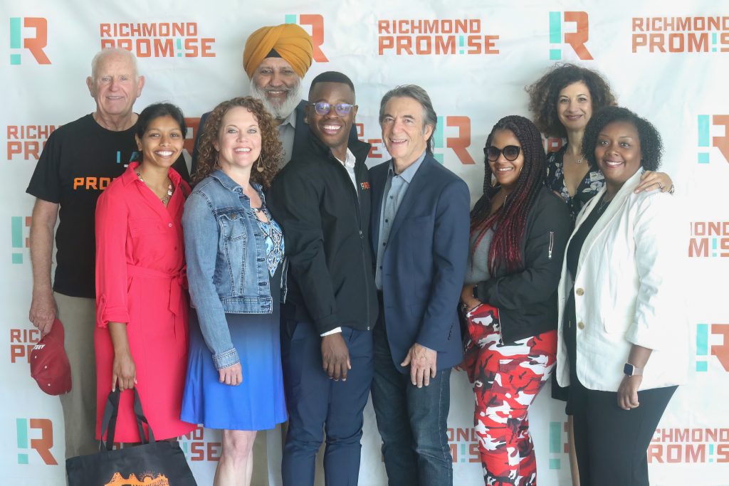 Richmond Promise Executive Director Christopher Whitmore, RP Board Members, elected officials and community leaders pose for a photo in front of a RP backdrop prior to the RP Scholar Celebration on August 3, 2024