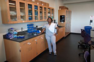 Avyanah Washington poses for a photo in a classroom lab at Sacramento State University