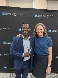 Chris Whitmore and Jessie Stewart pose for a photo with Richmond Promise's National Impact Award at the 2025 College Promise National Convening