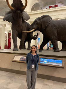 Marelyn Gonzalez poses for a photo in front of an elephant at the Field Museum in Chicago